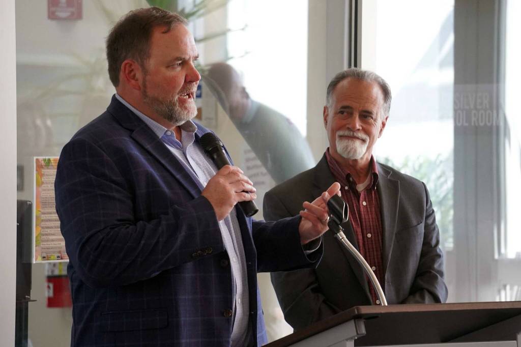 Kenai Peninsula Borough School District Superintendent Clayton Holland and Kenai Peninsula Borough Mayor Peter Micciche speak at a celebration of the 60th anniversary of Kenai Peninsula College in Soldotna, Alaska, on Tuesday, Aug. 20, 2024. (Jake Dye/Peninsula Clarion)