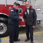 Robert Cicciarella (left), now-retired Kachemak Emergency Services fire chief, shakes hands with Kenai Peninsula Borough Mayor Peter Micciche (right) during Cicciarellas retirement party on Monday, Sept. 9, 2024, at KESA Station 1 in Homer, Alaska. Photo by Wendy Bales