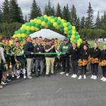 Photo by Jeff Helminiak/Peninsula Clarion
Center, from left: Kenai Peninsula Borough School District Superintendent Clayton Holland; Borough Mayor Peter Micciche; Seward High Student Council President Otto Nipp; and Seward High School Principal Dr. Henry Burns participate in a ribbon-cutting ceremony for a new turf field at Roger Steinbrecher Memorial Field at Seward High School, Friday, Sept. 13.