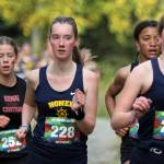 Homers Claira Booz, right, and Beatrix McDonough, left, lead a small pack of runners during the Wasilla Trailblazer Invite on Friday, Sept. 13, 2024, in Wasilla, Alaska. (Photo by Jeremiah Bartz/Frontiersman)