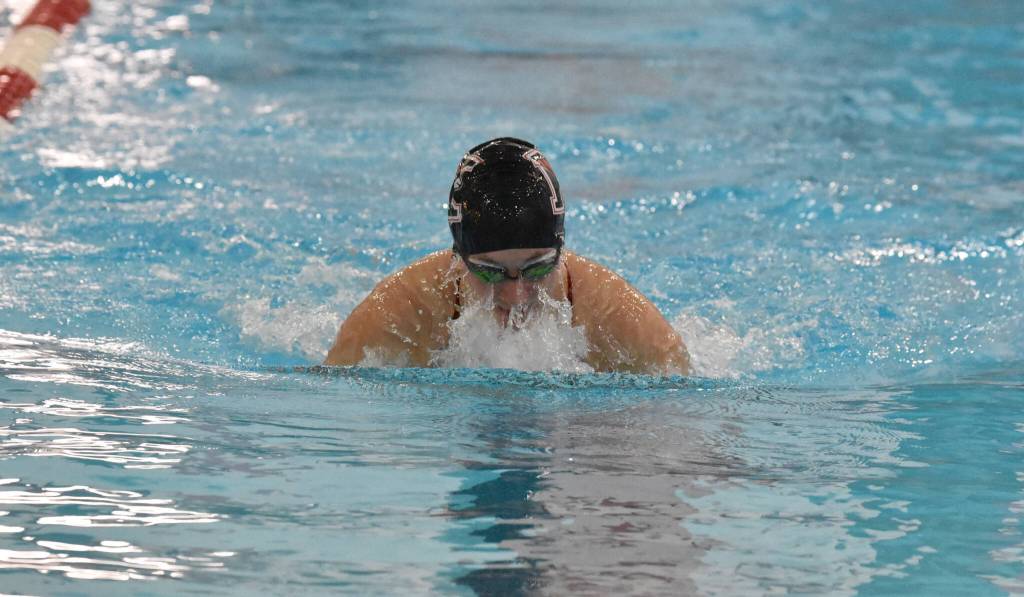 Kenai Centrals Isla Crouse competes in the 100-yard breaststroke at the Kenai Invitational on Saturday, Sept. 21, 2024, at Kenai Central High School in Kenai, Alaska. (Photo by Jeff Helminiak/Peninsula Clarion)