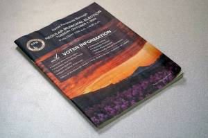 A Kenai Peninsula Borough Voter Information Pamphlet rests on a desk in the Peninsula Clarions newsroom in Kenai, Alaska, on Tuesday, Sept. 24, 2024. (Jake Dye/Peninsula Clarion)