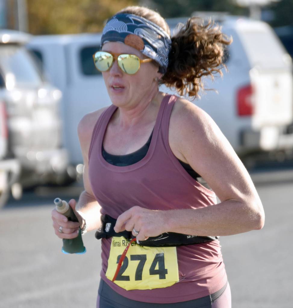 Homers Kristen Buckwalter runs to victory in the womens half marathon at the Kenai River Marathon on Sunday, Sept. 29, 2024, in Kenai, Alaska. (Photo by Jeff Helminiak/Peninsula Clarion)