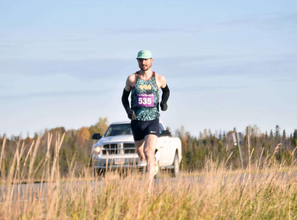 Kenais Jason Parks runs to a win in the mens marathon at the Kenai River Marathon on Sunday, Sept. 29, 2024, in Kenai, Alaska. (Photo by Jeff Helminiak/Peninsula Clarion)