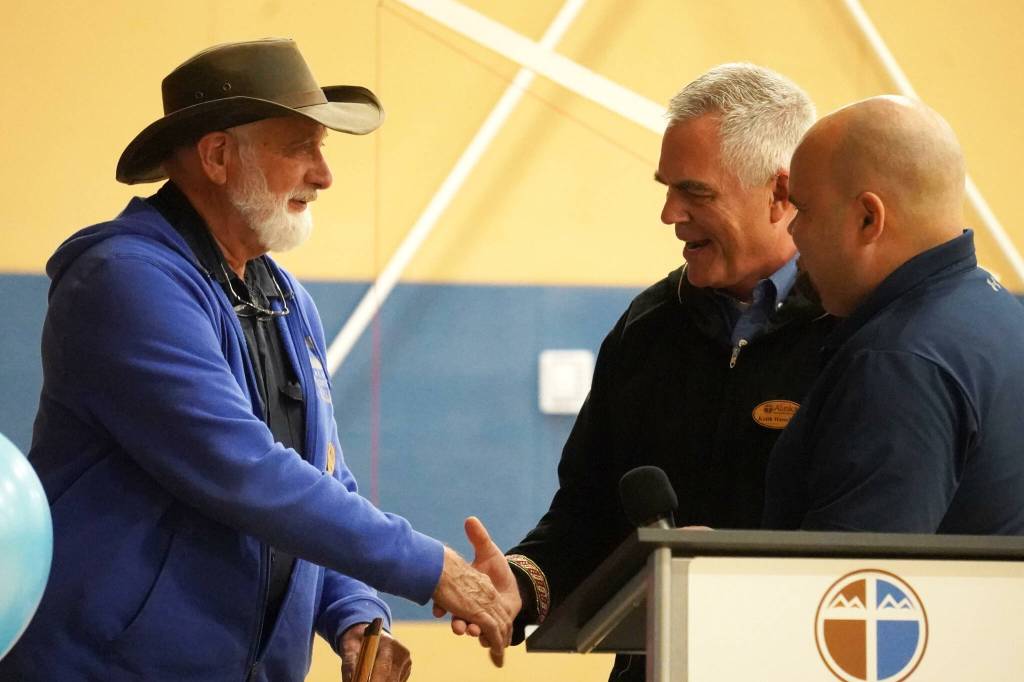 Harvey Lundquist, left, is celebrated as he retires after 17 years at Alaska Christian College during a dedication ceremony for the colleges new athletic center at Alaska Christian College in Soldotna, Alaska, on Friday, Sept. 27, 2024. (Jake Dye/Peninsula Clarion)