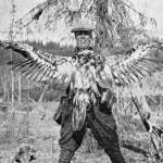 This photo of Warren Melville Nutter, holding a dead juvenile bald eagle that he shot for the bounty, appeared in the May 1938 edition of The Alaska Sportsman Magazine. The photo was probably taken near the mouth of Hidden Creek on Skilak Lake.