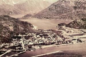 An aerial view of old town Cordova is displayed on the wall of the Pioneers of Alaska Igloo No. 19, established in 1918, during a tour of the Igloo at the Alaska Historical Society Conference in October 2024.  (Emilie Springer/Homer News)