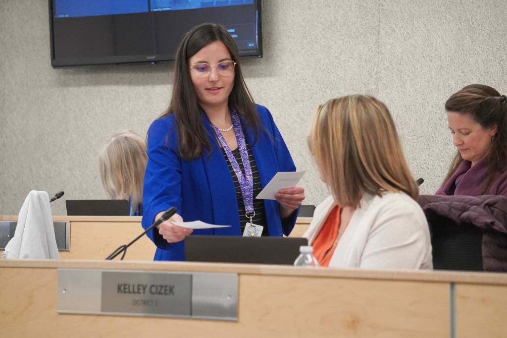 Administrative Secretary Nikkol Sipes passes out ballots during a reorganization of the Kenai Peninsula Borough School District Board of Education in Soldotna, Alaska, on Monday, Oct. 14, 2024. (Jake Dye/Peninsula Clarion)
