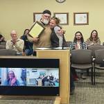 Emilie Springer/Homer News
Homers new mayor, Rachel Lord, presents outgoing Mayor Ken Castner with a plaque recognizing his service to the City of Homer at the conclusion of the city council meeting at the Cowles Council Chambers at Homer City Hall on Oct. 14.