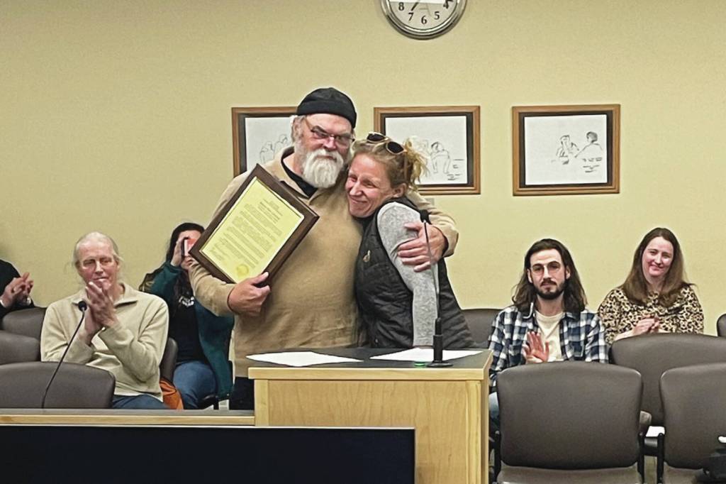 Homers new mayor, Rachel Lord, presents outgoing Mayor Ken Castner with a plaque recognizing his service to the City of Homer at the conclusion of the city council meeting at the Cowles Council Chambers at Homer City Hall on Oct. 14, 2024, in Homer, Alaska. (Emilie Springer/Homer News)