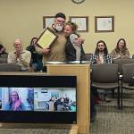 Homers new mayor Rachel Lord presents Ken Castner with a plaque recognizing his service to the city of Homer at the conclusion of the City Council meeting at the Cowles Council Chambers at Homer City Hall on Oct. 14, 2024. Emilie Springer/ Homer News
