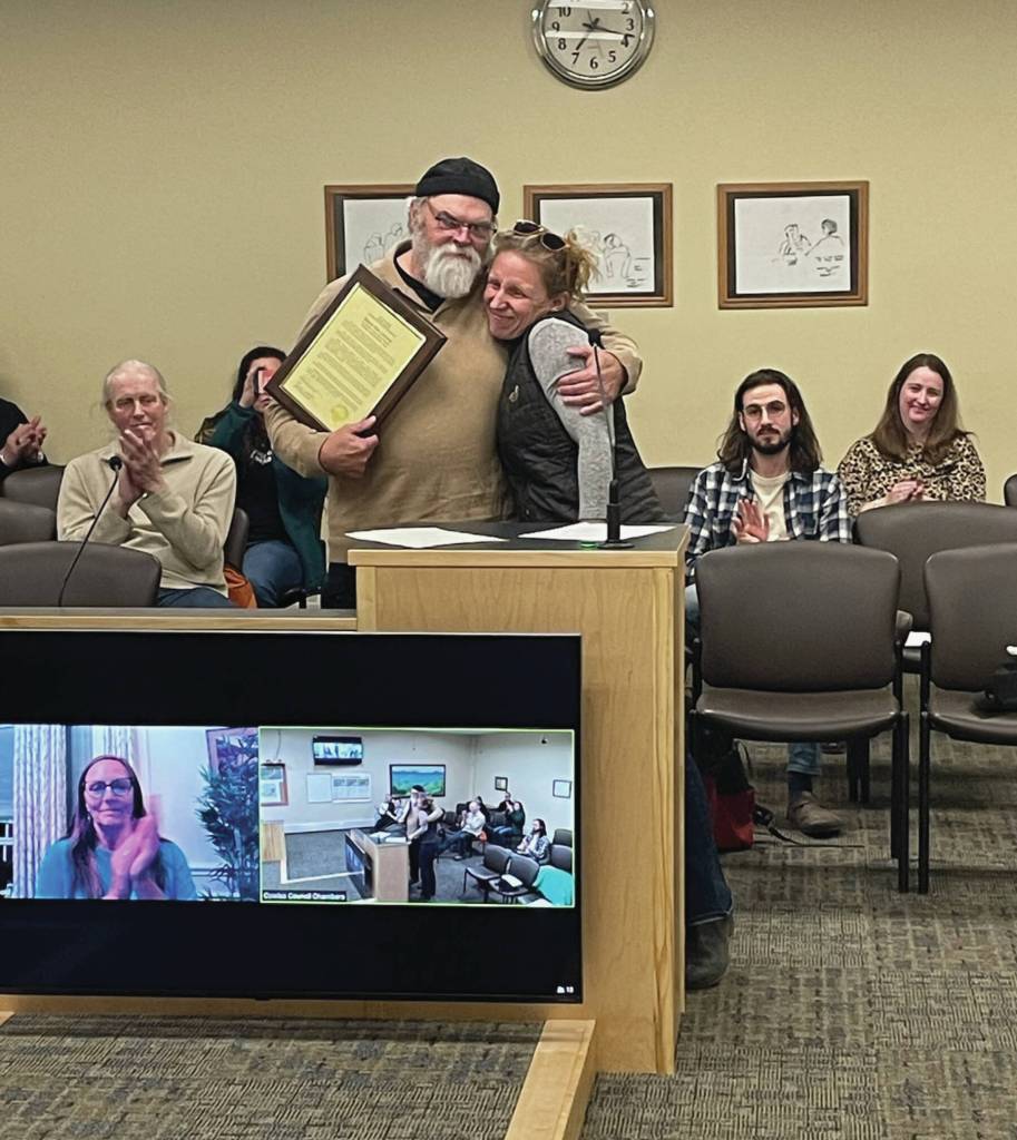 Homers new mayor Rachel Lord presents Ken Castner with a plaque recognizing his service to the city of Homer at the conclusion of the City Council meeting at the Cowles Council Chambers at Homer City Hall on Oct. 14, 2024. Emilie Springer/ Homer News