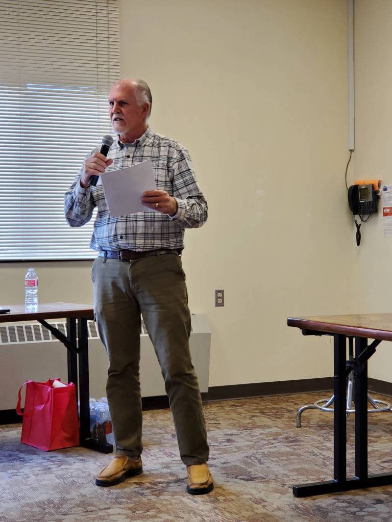 Homer Chamber of Commerce executive director Brad Anderson moderates a forum for the Alaska State House District 6 candidates on Monday, Oct. 14, 2024, at Kachemak Bay Campus in Homer, Alaska. (Delcenia Cosman/Homer News)