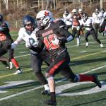 Kenai Centrals Bobby Hayes runs against Homers Nikifor Reutov on Saturday, Oct. 19, 2024, in the Division III First National Bowl at Veterans Memorial Field at Wasilla High School in Wasilla, Alaska. (Photo by Jeff Helminiak/Peninsula Clarion)