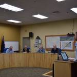 Doyon representative Zach Dunlap (right) presents the revised application for the Lighthouse Village redevelopment during a special Planning Commission meeting on Wednesday, Oct. 16, 2024, in the Homer City Hall Cowles Council Chambers in Homer, Alaska. (Delcenia Cosman/Homer News)