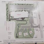 A schematic site plan of Doyon, Limiteds revised Lighthouse Village redevelopment design is on display during a special Planning Commission meeting on Wednesday, Oct. 16, 2024, in the Homer City Hall Cowles Council Chambers in Homer, Alaska. (Delcenia Cosman/Homer News)