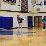 Reilly Sue Baker serves the ball during the varsity volleyball game against Nikiski on Thursday, Oct. 17, 2024, in the Homer High School Alice Witte Gymnasium in Homer, Alaska. (Emilie Springer/Homer News)