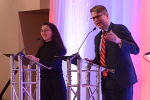 Republican U.S. House candidate Nick Begich speaks to an audience at the Alaska Chamber of Commerces U.S. House debate on Thursday, Oct. 10, 2024, in Fairbanks. At left is incumbent Rep. Mary Peltola, D-Alaska. (James Brooks/Alaska Beacon)