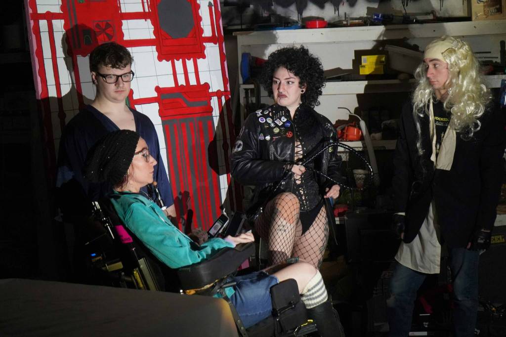 The cast of Intuition Salons shadow cast of Rocky Horror Picture Show rehearse in Kenai, Alaska, on Monday, Oct. 21, 2024. (Jake Dye/Peninsula Clarion)