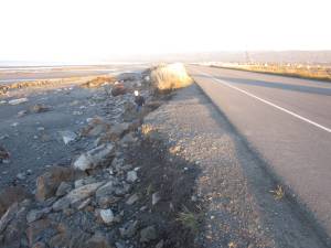 Erosion damage to the Homer Spit Road roadbed, caused by a severe winter storm event on Oct. 16, is photographed on Thursday, Oct. 17, 2024, in Homer, Alaska. The worst of the erosion occurred across the road from the Heritage RV campground office on the Spit. Photo by Bryan Hawkins