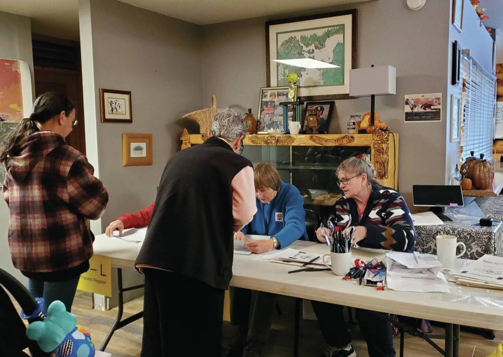 Poll workers sign in voters and hand out ballots at the Anchor Point Community and Senior Center, the polling location for the Anchor Point precinct, on Tuesday, Nov. 5<ins>, 2024, in Anchor Point, Alaska</ins>. (Delcenia Cosman/Homer News)