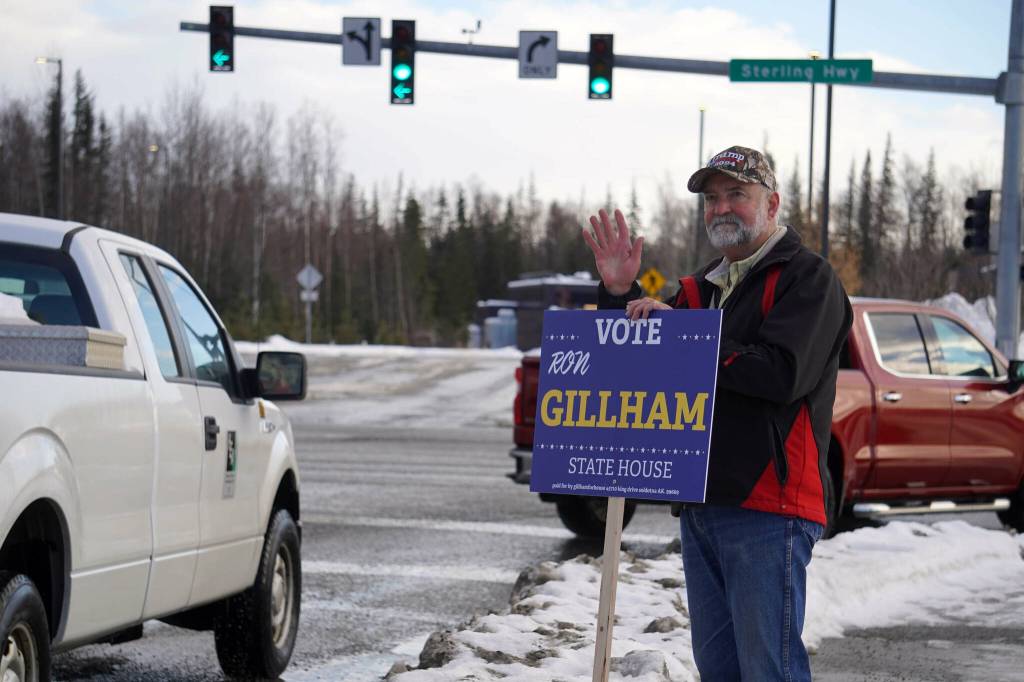 Ron Gillham waves at passersby along the Kenai Spur Highway in Soldotna, Alaska, on Tuesday, Nov. 5, 2024. (Jake Dye/Peninsula Clarion)