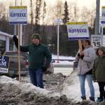 Justin Ruffridge and other supporters wave at passersby along the Sterling Highway in Soldotna, Alaska, on Tuesday, Nov. 5, 2024. (Jake Dye/Peninsula Clarion)