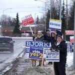 Signs and supporters line the Kenai Spur Highway in Kenai, Alaska, on Tuesday, Nov. 5, 2024. (Jake Dye/Peninsula Clarion)