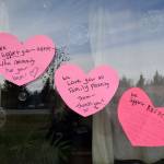 Letters of support are posted to the window of the Kachemak Bay Family Planning Clinic on Tuesday, Nov. 12, 2024, following a shooting incident on Monday, Nov. 11 at 5:45 a.m. in Homer, Alaska. (Delcenia Cosman/Homer News)