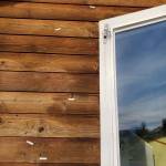 Multiple bullet holes in the front exterior of the Kachemak Bay Family Planning Clinics administrative and education building are marked on Tuesday, Nov. 12, 2024, following a shooting incident that occurred on Monday, Nov. 11 in Homer, Alaska. (Delcenia Cosman/Homer News)