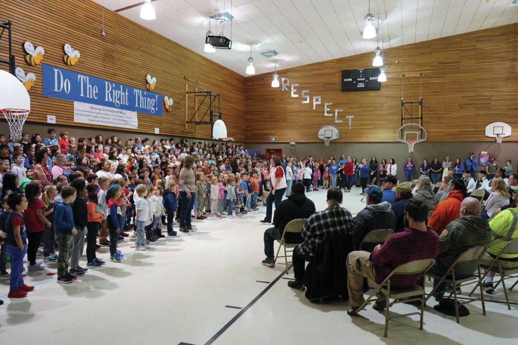 Jake Dye/Peninsula Clarion
Students sing My Country, Tis of Thee at Mountain View Elementary in Kenai during a celebration of Veterans Day on Monday.