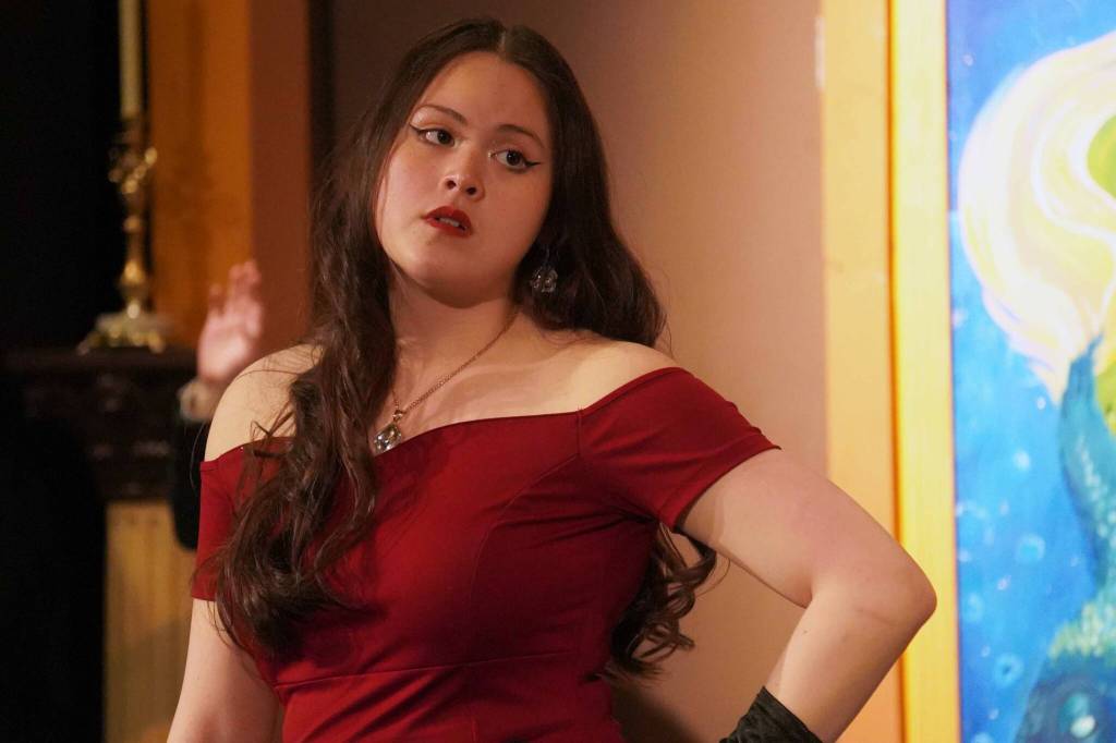 Somi Clendaniel, as Miss Scarlet, rehearses Seward High School Theatre Collectives Clue at Seward High School in Seward, Alaska, on Thursday, Nov. 7, 2024. (Jake Dye/Peninsula Clarion)