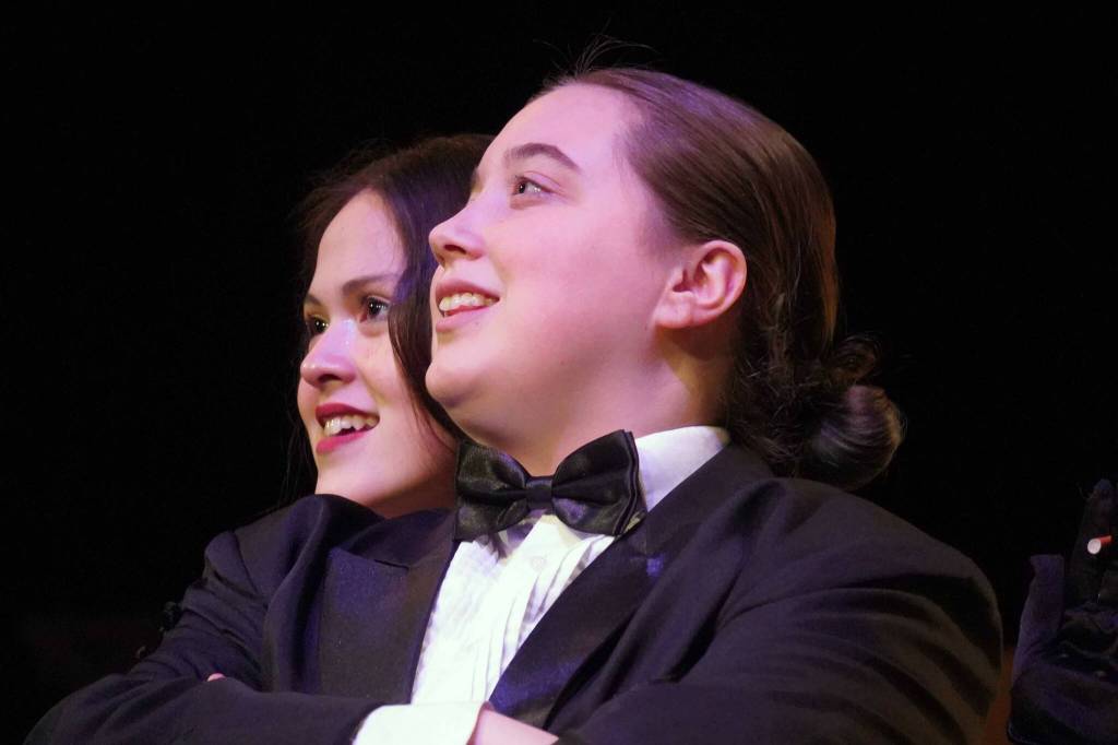 Somi Clendaniel, as Miss Scarlet, and Angel Wagner, as Wadsworth, rehearse Seward High School Theatre Collectives Clue at Seward High School in Seward, Alaska, on Thursday, Nov. 7, 2024. (Jake Dye/Peninsula Clarion)
