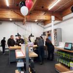 Community members check out the new Verizon authorized retailer on Pioneer Avenue during Victras grand opening on Thursday, Nov. 21, 2024, in Homer, Alaska. (Delcenia Cosman/Homer News)