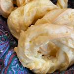 These light and savory cheesy ring puff snacks are piped pate a choux with a generous handful of shredded edam cheese. (Photo by Tressa Dale/Peninsula Clarion)