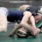 Soldotnas Valarie McAnelly works to pin Colonyճ Tiffany Churchill during the girls 107-pound match in the finals of the Colony Invitational on Saturday, Nov. 23, 2024, at Colony High School in Palmer, Alaska. (Photo by Jeremiah Bartz/Frontiersman)