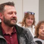 Evan Frisk calls for full-time staffing of the Central Emergency Services Kasilof station during a meeting of the CES Joint Operational Service Area Board on Thursday, Nov. 21, 2024, at Soldotna Prep School in Soldotna, Alaska. (Jake Dye/Peninsula Clarion)