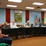 Jill Garnet, left, calls for full-time staffing of the Central Emergency Services Kasilof station during a meeting of the CES Joint Operational Service Area Board on Thursday, Nov. 21, 2024, at Soldotna Prep School in Soldotna, Alaska. (Jake Dye/Peninsula Clarion)