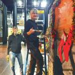 Michael McKinney and Bobby McKinney add finishing touches to the party scene fireplace at the Homer Nutcracker rehearsals on Sunday Dec. 1, 2024, at the Homer Mariner Theater, in Homer, Alaska. (Emilie Springer/ Homer News)