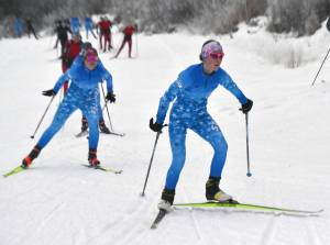 Soldotnas Tania Boonstra leads Soldotnas Ariana Cannava and the rest of the pack at the girls varsity race of the Turkey Skate on Tuesday, Nov. 26, 2024, at Tsalteshi Trails just outside of Soldotna, Alaska. (Photo by Jeff Helminiak/Peninsula Clarion)