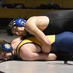 Kenai Centrals Atlas Ruark works his way to a 5-1 decision over Homers Alexander Van Meter on Tuesday, Nov. 26, 2024, at Nikiski Middle-High School in Nikiski, Alaska. (Photo by Jeff Helminiak/Peninsula Clarion)