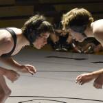 Nikiski's Wyatt Maguire works his way to a pin of Kenai Central's Conner Cook on Tuesday, Nov. 26, 2024, at Nikiski Middle-High School in Nikiski, Alaska. (Photo by Jeff Helminiak/Peninsula Clarion)