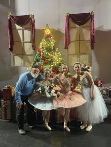 Emilie Springer/ Homer News
Ken Castner with Nutcracker senior dancers Natalia Sherwood, Tiya Martushev and Sofia Loboy in front of the Stahlbaum Christmas tree after last Sundays matinee performance.