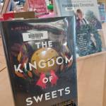 Erika Johansens novel, The Kingdom of Sweets, is part of a holiday display at the Homer Public Library in Homer, Alaska. (Delcenia Cosman/Homer News)