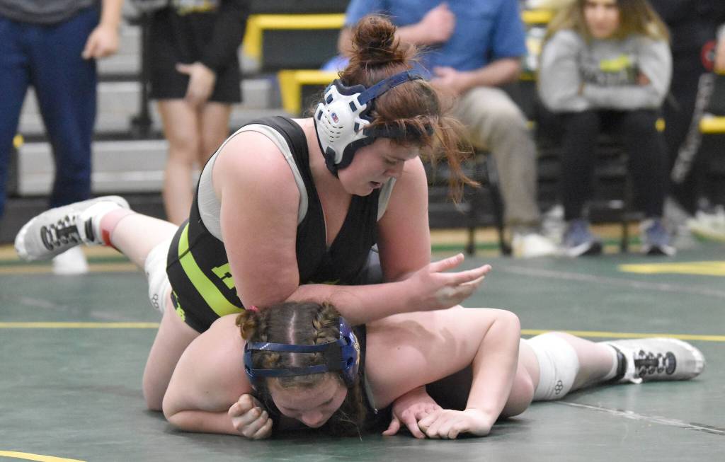 Redingtons Nikayla Miller wrestles to a victory over Homers Araya Andres in the championship match at 185 at the Kachemak Conference wrestling tournament at Seward High School in Seward, Alaska, on Saturday, Dec. 14, 2024. (Photo by Jeff Helminiak/Peninsula Clarion)