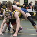 Kenai Centrals Thaddeus Lingenfelter wrestles to a victory over Homers Isaiah Mann in the championship match at 189 pounds at the Kachemak Conference wrestling tournament at Seward High School in Seward, Alaska, on Saturday, Dec. 14, 2024. (Photo by Jeff Helminiak/Peninsula Clarion)