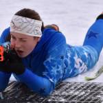 Soldotna's Inga Smith aims at the Candy Cane Scramble on Friday, Dec. 20, 2024, at Tsalteshi Trails just outside of Soldotna, Alaska. (Photo by Jeff Helminiak/Peninsula Clarion)
