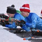From left to right, Soldotna's Owen Bell, Soldotna's Jacob Ries and Kenai Central's Benjamin Roberts take to the range at the Candy Cane Scramble on Friday, Dec. 20, 2024, at Tsalteshi Trails just outside of Soldotna, Alaska. (Photo by Jeff Helminiak/Peninsula Clarion)
