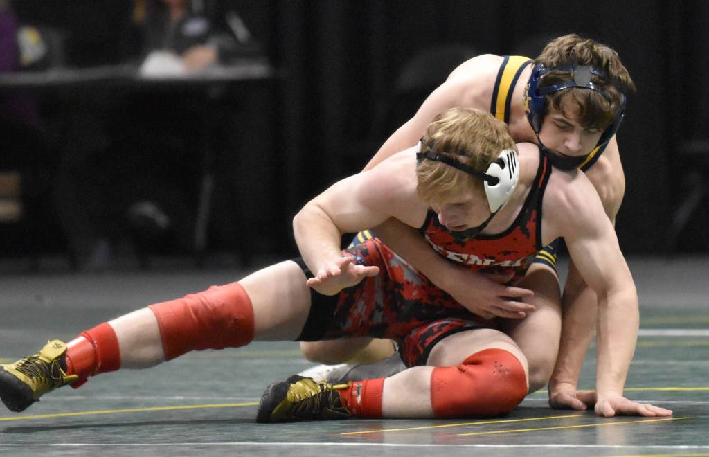 Kenai Centrals Daniel Steffensen wrestles to a 14-0 major decision against Homers Landyn Woods in the final at 152 pounds at the Division II state wrestling tournament Saturday, Dec. 21, 2024, at the Alaska Airlines Center in Anchorage, Alaska. (Photo by Jeff Helminiak/Peninsula Clarion)