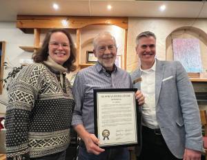 Alaska Representatives Sarah Vance from Homer and Andrew Gray from Anchorage present Tom Kizzia with a state legislative citation award at the Homer Public Library on Tuesday, Dec. 17.  Photo provided by Cheryl Illg with Friends of the Homer Public Library.
